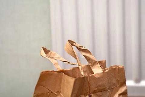 Top section of an eco-friendly paper bag designed for potatoes, featuring stu Stock Photos