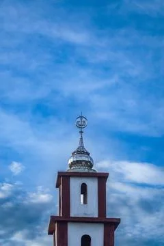 Top Section of a Mosque Minaret with Allah Calligraphy Against Blue Sky Stock Photos
