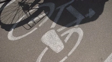 From the top shot of bike path and bike shadow. Stock Footage