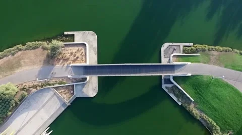 Top shot a bridge over river with bicycle Stock Footage 55868604