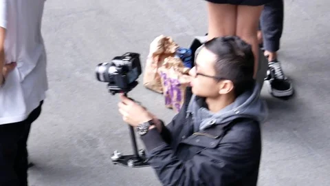 Top shot of camera chasing people having activities at public park Video stock 84289546