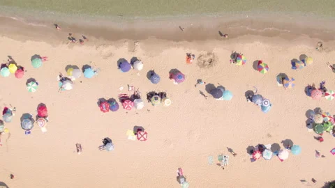 Top shot of crowded summer beach with colorful umbrellas Stock Footage 159133568