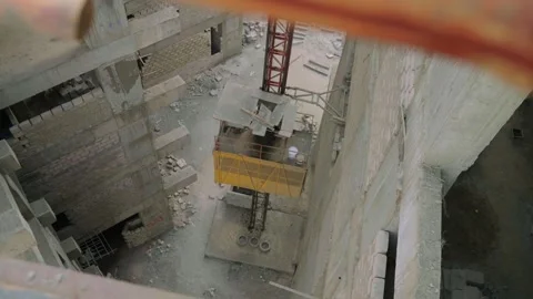 Top shot of elevator heading up during construction work in Karachi, Pakistan Stock Footage 306113735
