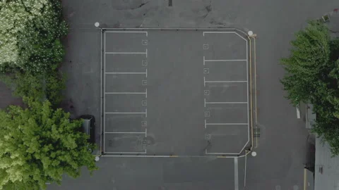 Top shot empty parking lot. dry asphalt sunny day. white line markings Stock Footage 154964909