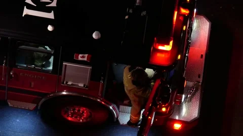 Top shot of firefighter preparing leaving and getting on the fire truck Stock-Footage 131827126