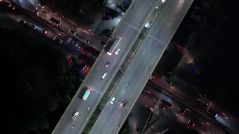 Top shot of flyover with vehicles passing down during dusk in India. Drone view. Stock Footage 306286667
