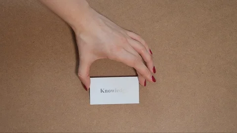 Top shot - Hand puts paper cards CREATIVITY and KNOWLEDGE. CORE VALUE concept. Vídeo Stock 124709729