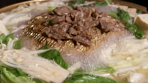 Top shot of hot pot boiling inside Chinese restaurant with 4k resolution Video stock 97154185