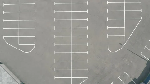 Top shot large empty parking lot. dry asphalt sunny day. white line markings Video stock 154883687
