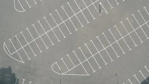 Top shot large empty parking lot. dry asphalt sunny day. white line markings Stock Footage 154883835