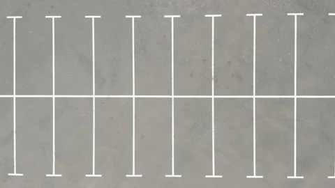 Top shot large empty parking lot. dry asphalt sunny day. white line markings Stock Footage 154883952