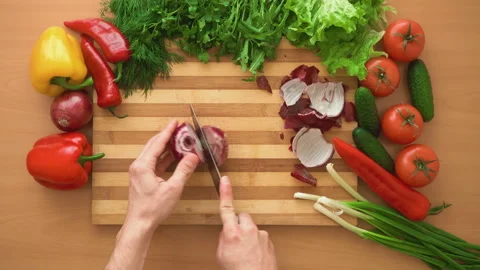 Top shot of man chef cutting bow on chopping wooden board Stock Footage 87805551