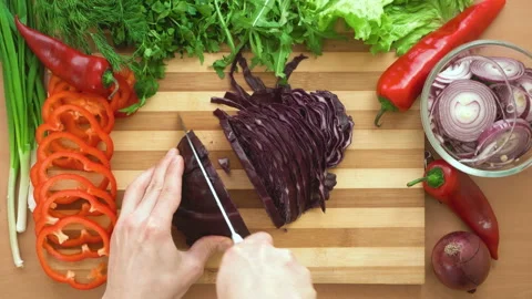 Top shot of man chef cutting cabbage on chopping wooden board Stock Footage 87905773