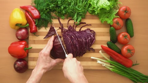 Top shot of man chef cutting cabbage on chopping wooden board Stock Footage 87983907
