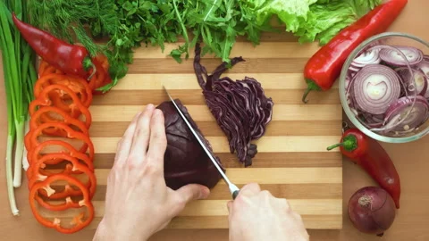 Top shot of man chef cutting cabbage on chopping wooden board Stock Footage 88071850