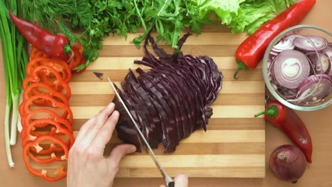 Top shot of man chef cutting cabbage on chopping wooden board Stock Footage 88073320