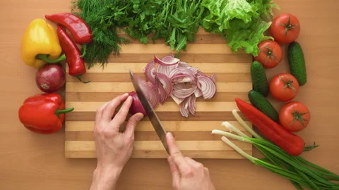 Top shot of man chef cutting bow on chopping wooden board Stock Footage 88165486