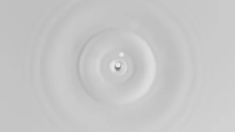 Top shot of milk drop in super slow motion, shooted with high speed cinema Stock Footage 100684327