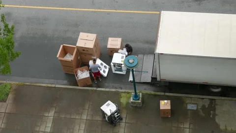 Top shot of movers unloading electric home appliances with 4k resolution Stock Footage 125500359