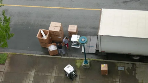 Top shot of movers unloading electric home appliances with 4k resolution Stock Footage 125500884