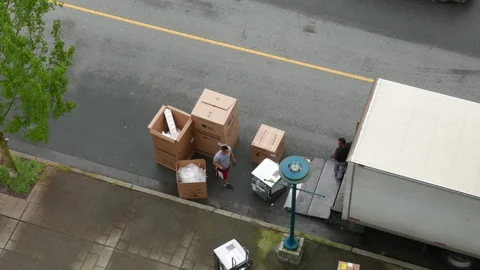 Top shot of movers unloading electric home appliances with 4k resolution Stock Footage 125653964
