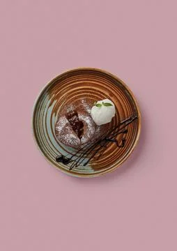 Top shot pink background patterned flat brown plate with chocolate brownie Stock Photos