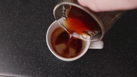 Top shot of pouring finished filter coffee into white mug Stock Footage 332720242