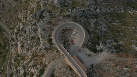 Top shot of the road - loop with a red car in the mountains Stock Footage 119443234