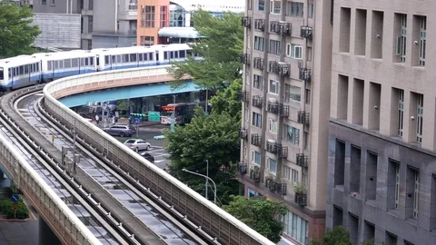 Top shot of skytrain passing beside building during rush hour in Taipei Taiwan Video stock 81377555