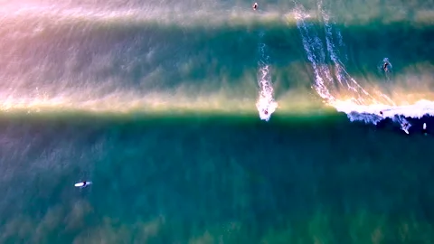 Top shot of surfers riding waves Stock Footage 340558131