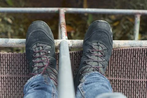 Top shot view, from high angle, of a man's dark hiking boots Stock Photos