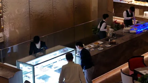 Top shot of worker cleaning bucket at dessert area inside Chinese restaurant Video stock 102594577
