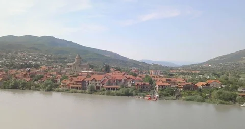 Top side Aerial view of beautiful Mtskheta and Mtkvari Lake Stock Footage 110695989