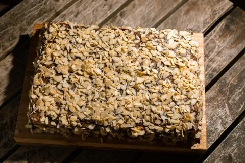 Top side view of cake covered in almonds Stock Photos