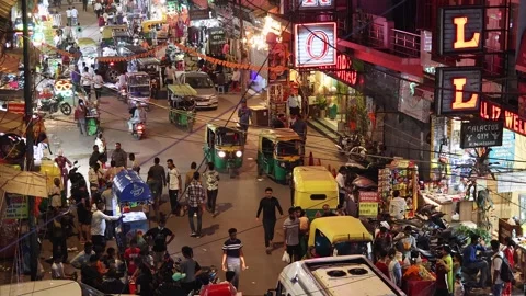 Top side view of the Main Bazar road with buzy traffic at late evening Stock Footage 279184595