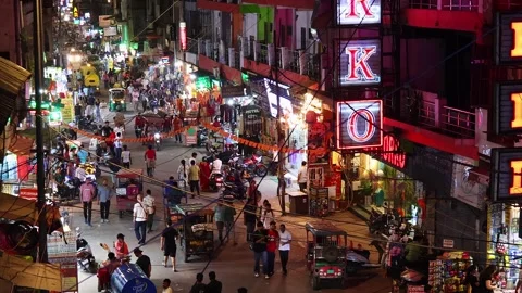 Top side view of the Main Bazar road with buzy traffic in the evening Stock Footage 279184813