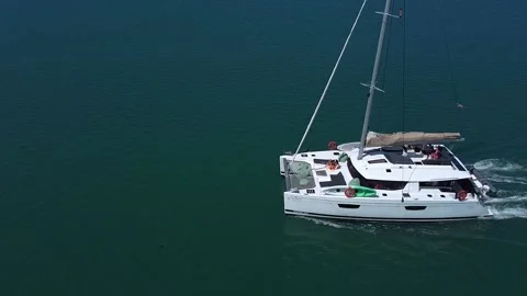 Top side view of a sailing catamaran while moving on the sea Video stock 218175392