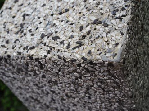 Top square corner of grainy black white stone wall corner 库存照片