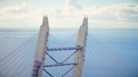 Top steel structure cable stayed bridge over sea on background cloudy sky Stock Footage 85019899