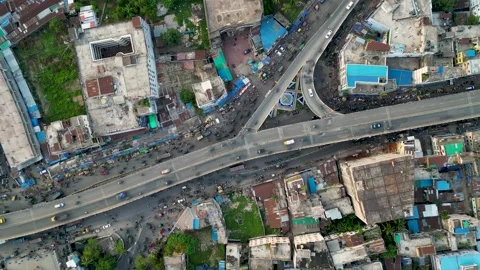 A top, still view of traffic on both an overpass and the road below. Vehicles of Stock Footage 287775720