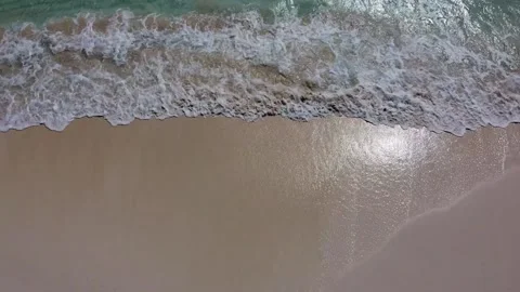 Top straight down aerial view above sandy beach Stock Footage 137534119