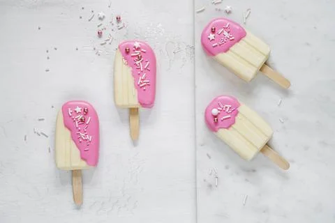 Top table view on four delicious vanilla ice cream bars. Stock Photos