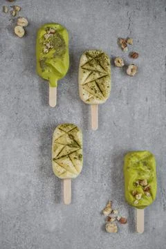 Top table view on four delicious vanilla and matcha ice cream bars. Stock Photos