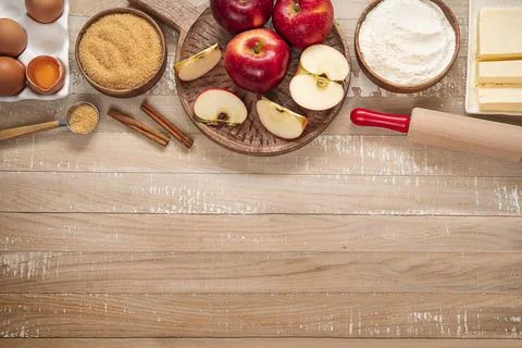 Top table view on ingredients for Apple pie or Charlotte. Stock Photos