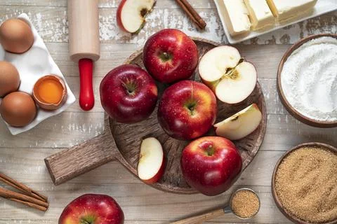 Top table view on ingredients for Apple pie or Charlotte. Stock Photos