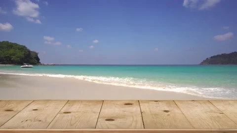 Top table wooden on the beach in summer sun ocean sea background. Vídeos de archivo 153384293