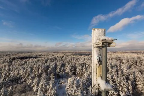 Top of telecommunication tower with vertical panel antennas and remote radio Stock Photos