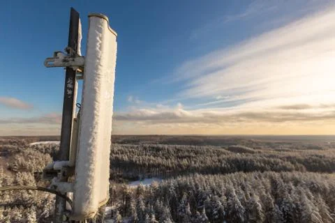 Top of telecommunication tower with vertical panel antennas and remote radio Stock Photos