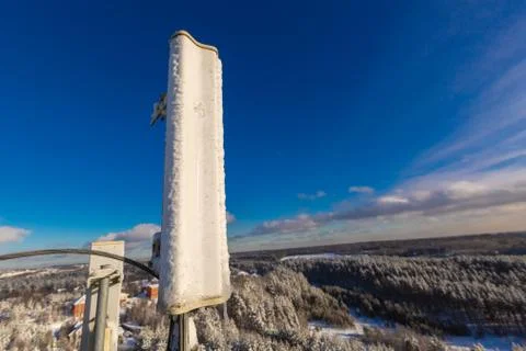 Top of telecommunication tower with vertical panel antennas and remote radio Stock Photos