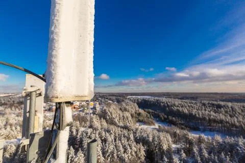 Top of telecommunication tower with vertical panel antennas and remote radio Stock Photos